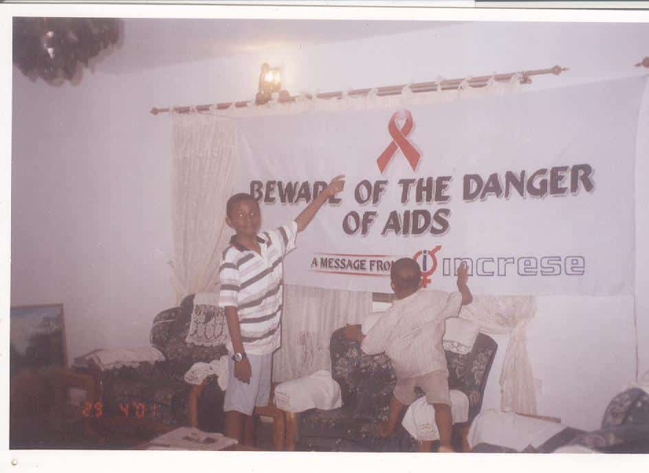 2001, Gbagada, Lagos State: Dorothy's older kids [Samson and Samuel Aken'Ova] messing around with the campaign banner designed and left to dry by their father, George Aken'Ova.